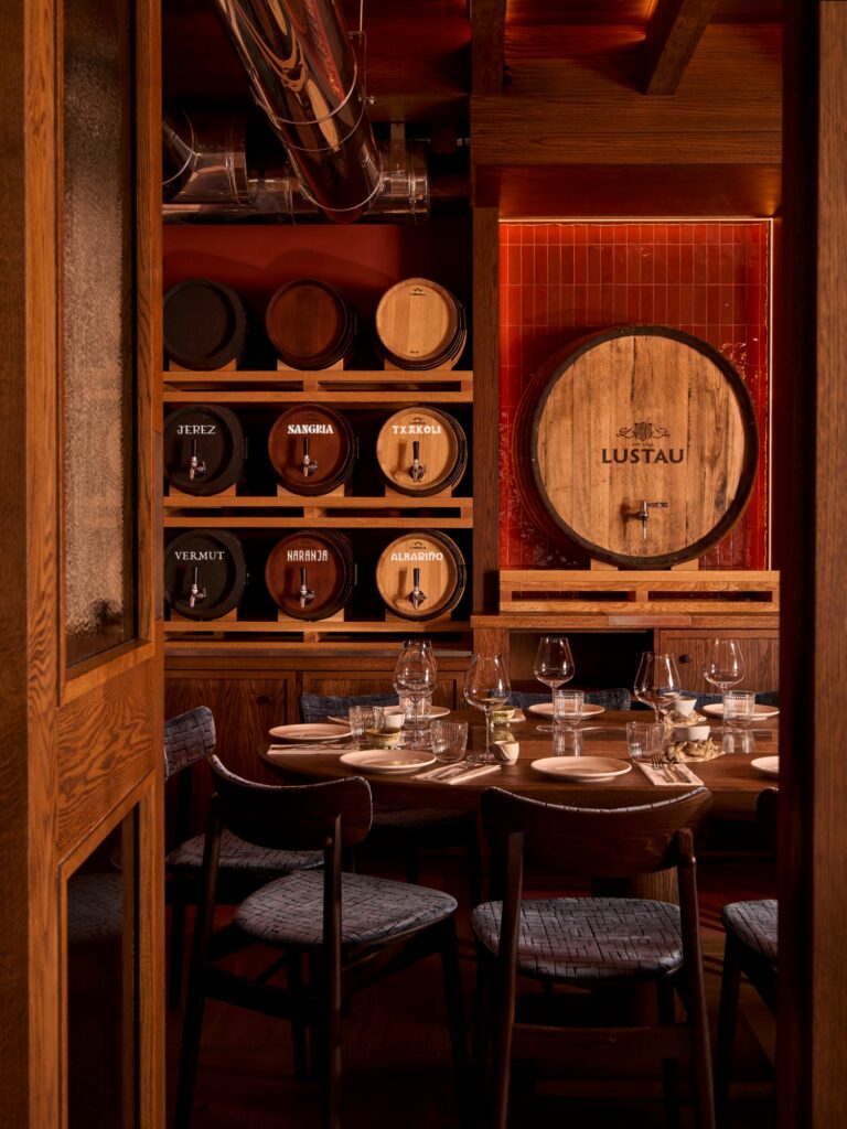 Barrel wall and set table in Txoko, Legado private dining room